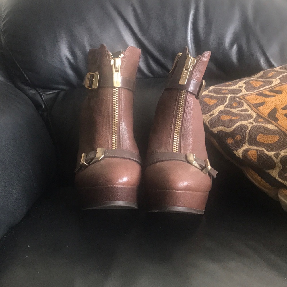 Brown zippered and buckled front booties